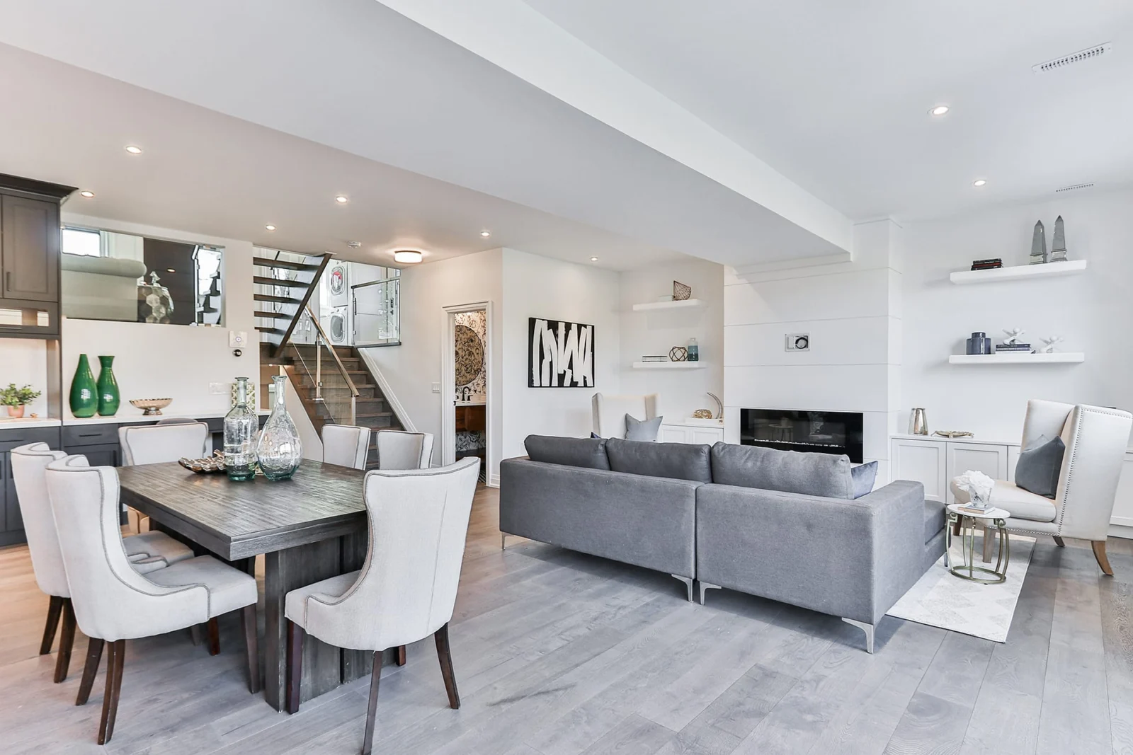 Home interior with a coffered ceiling and curved staircase